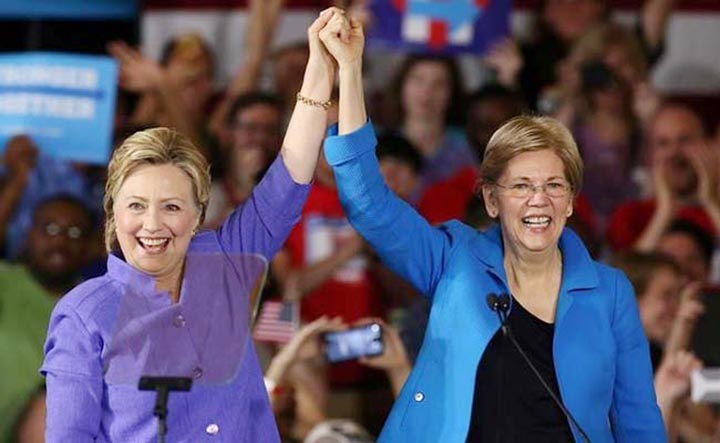 Democratic US presidential candidate Hillary Clinton stands alongside US Senator Elizabeth Warren at a campaign rally in Cincinnati, Ohio.