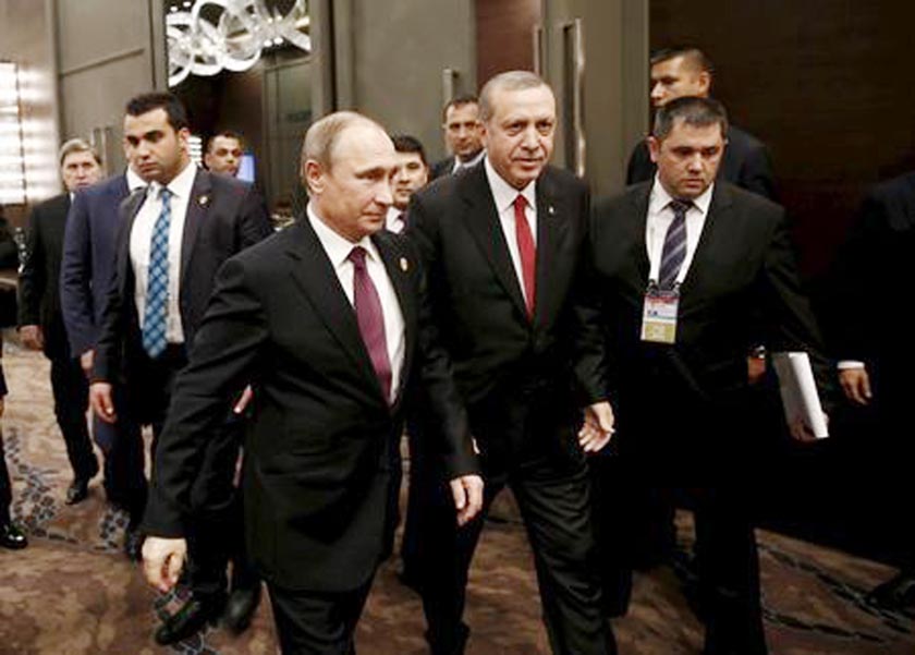 Turkey's President Tayyip Erdogan (2nd R) walks with his Russian counterpart Vladimir Putin prior to their meeting at the Group of 20 (G20) leaders summit in the Mediterranean resort city of Antalya, Turkey.