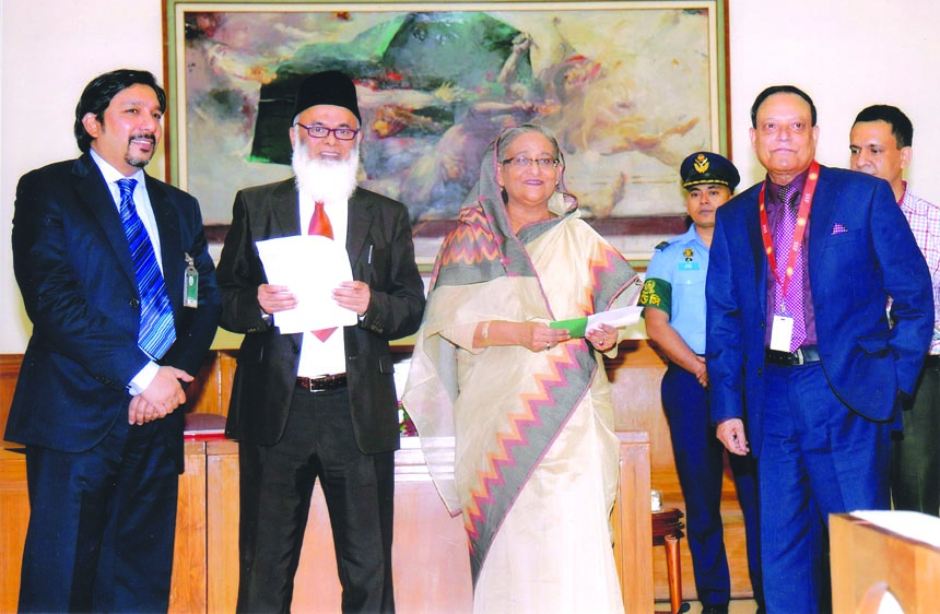 Habibur Rahman, Chairman, Board of Directors of Pbali Bank Ltd, handing over a cheque of Tk15 million to Prime Minister Sheikh Hasina at Ganabhaban in the capital recently.