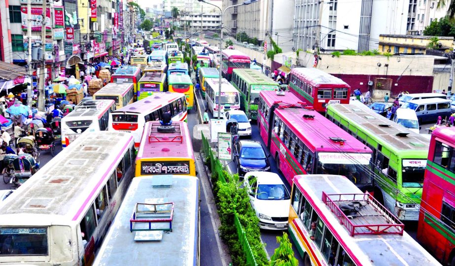 City people witnessing several traffic gridlock as most of the shopping malls, markets in city are overcrowded by Eid shoppers causing sufferings to commuters. This photo was taken from Topkhana area on Tuesday.