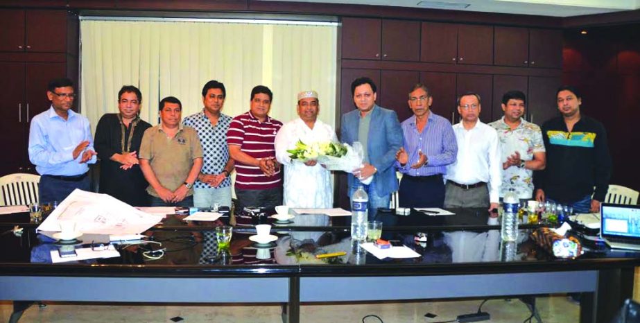 Rubel Aziz, President of Dhaka Boat Club Limited congratulates the newly elected President of the club Benazir Ahmed on Monday. Executive Committee members were also present during the occasion.