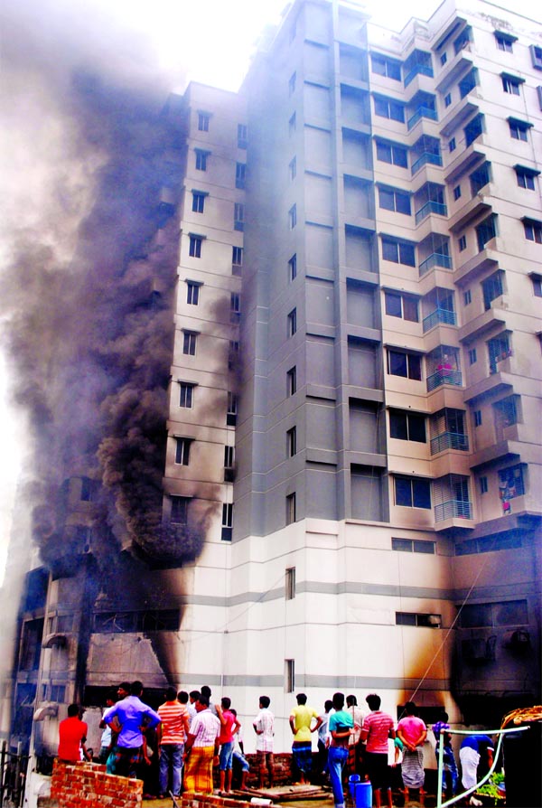 A devastating fire breaks out at 14-storey BTI Premium Plaza in city's Uttar Badda area 10 injured on Wednesday. Later fire fighters douse the flame.