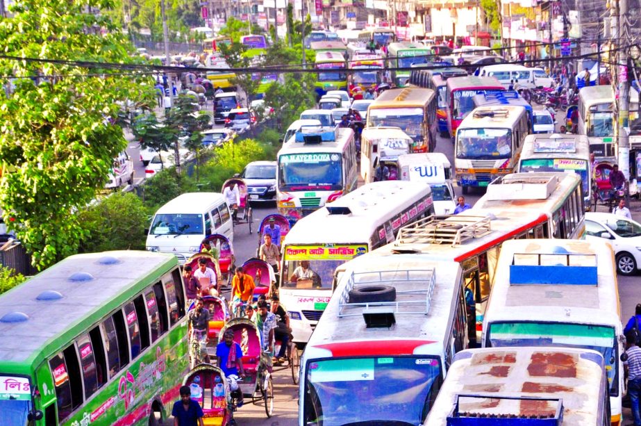 City people experienced massive traffic gridlock across the capital as Eid shoppers rush to the shopping malls and wayside shops to buy their choices ahead of Eid-ul-Fitr. This photo was taken from Motijheel area on Wednesday.