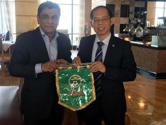 Senior Vice-President and General Secretary of Chinese Football Association Zhang Jian handing over a souvenir to President of Bangladesh Football Federation (BFF) Kazi Salahuddin at the Hotel Westin in the city on Thursday.