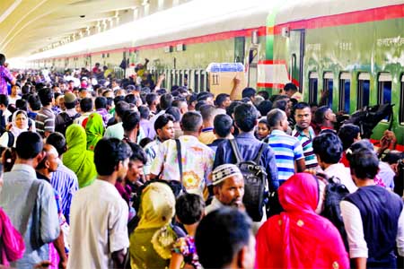 Thousands of home-bound people rush to Kamalapur Railway Station on the first day of special train introduced on Thursday to celebrate Eid-ul-Fitr with their family members.