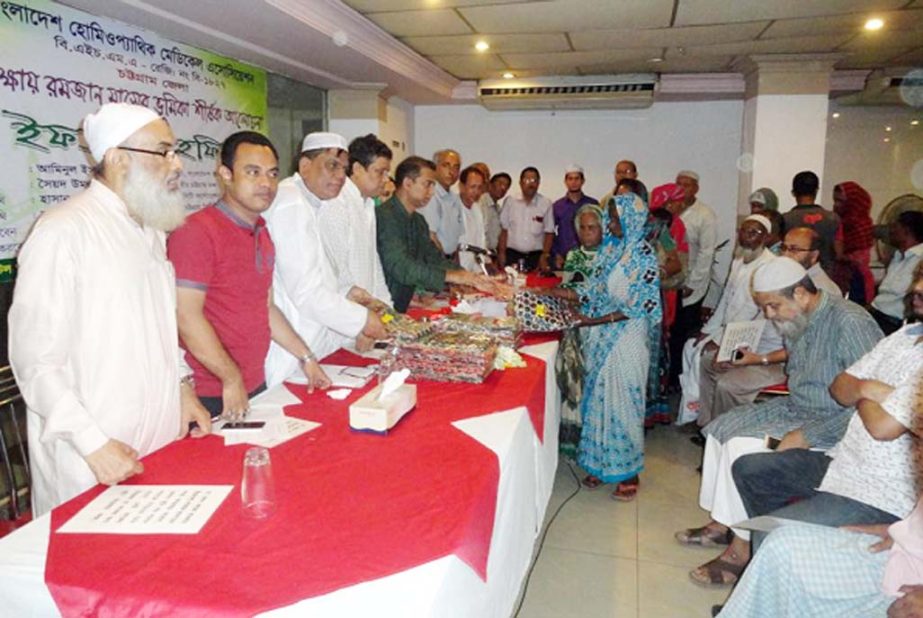 In the Iftar Mahfil of Bangladesh Homeopathic Medical Association, Chittagong Unit, Eid dresses were distributed among the distressed women by the chief guest on the occasion.