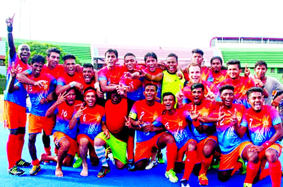 Players of Dhaka Mariner Youngs Club celebrating after emerging as the champions of the Green Delta Insurance Premier Division Hockey League at the Moulana Bhashani National Hockey Stadium on Friday.