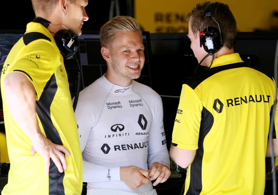 Renault driver Kevin Magnussen, center, of Denmark talks to to mechanics before the third practice session prior to the Formula One Grand Prix, at the Red Bull Ring in Spielberg, southern Austria on Saturday. The race is scheduled for Sunday.