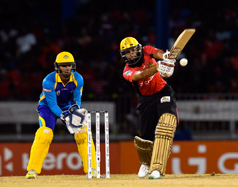 Hashim Amla of Trinbago Knight Riders hits out on his way to 81 during the CPL match between Trinbago Knight Riders and Barbados Tridents at Port-of-Spain on Friday.