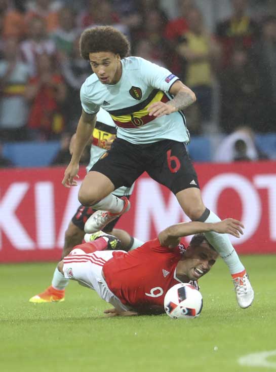 Belgium's Axel Witsel (top) challenges for the ball with Wales' Hal Robson Kanu during the Euro 2016 quarterfinal soccer match between Wales and Belgium, at the Pierre Mauroy stadium in Villeneuve dâ€™Ascq, near Lille, France on Friday.