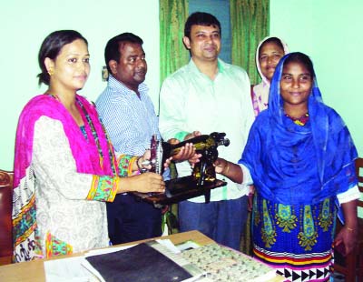 GANGACHARA (Rangpur): Shahnaza Afroz, Upazila Women Affairs Officer and Masud Rana, Cooperative Officer handing over sewing machines among the poor women organised by Hanger Project recently.