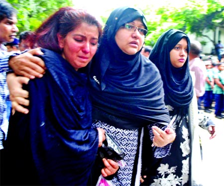Relatives mourn the deaths of their near and dear ones on Sunday who were killed by militants in front of Holey Artisan Bakery at Gulshan in Dhaka on Sunday.