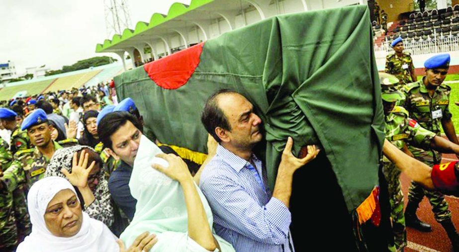 The coffin of those killed in separatists'attack in Holey Artisan Bakery in the city's Gulshan being handed over to their relatives after paying tributes to the deceased. The snap was taken from in front of the city's Army Stadium on Monday.