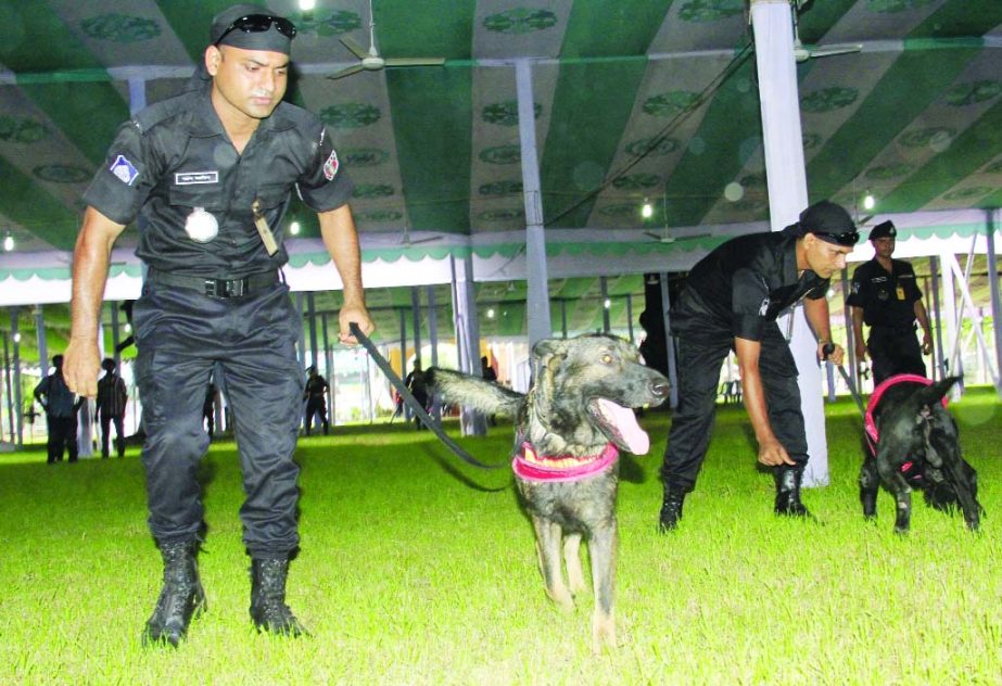 Law enforcers scanning the Jatiya Eidgah ground with Dog Squad for security measures. The snap was taken on Monday.