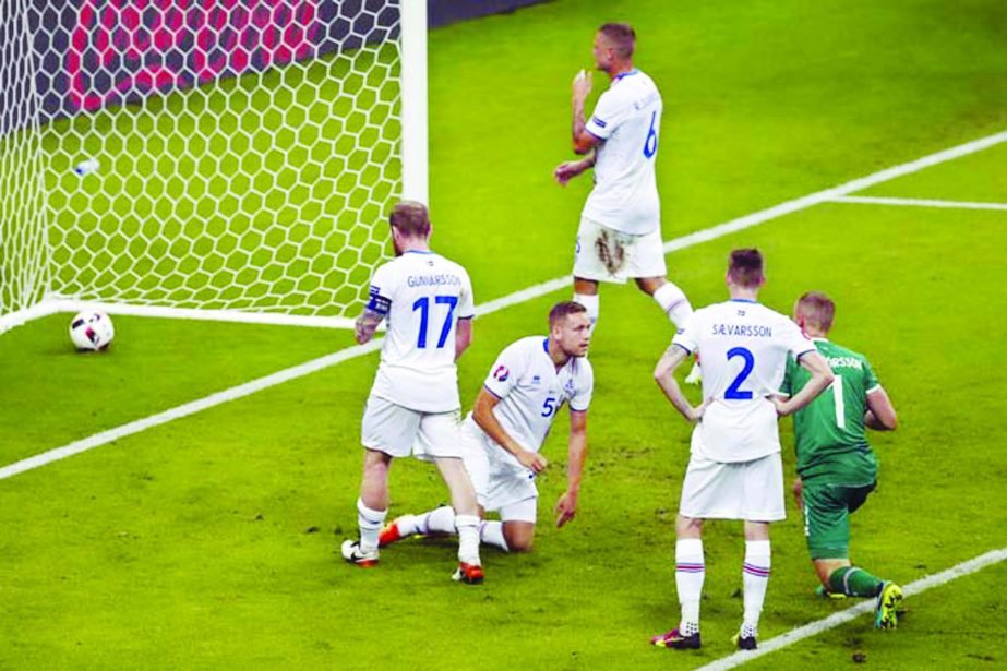 Iceland players react after France's Olivier Giroud scored his side's fifth goal during the Euro 2016 quarterfinal soccer match between France and Iceland, at the Stade de France in Saint-Denis, north of Paris, France on Sunday.