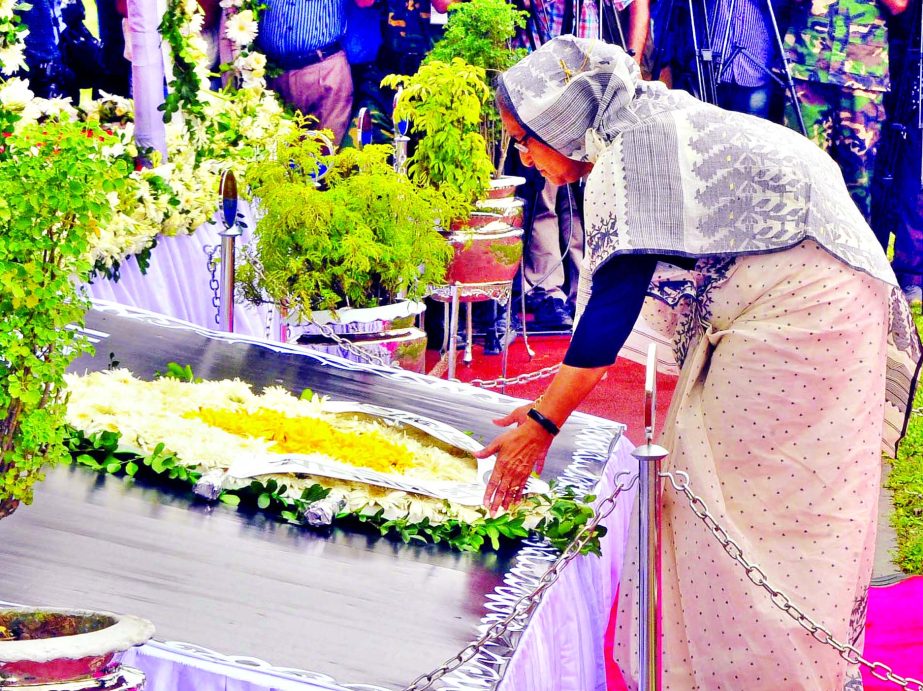 Prime Minister Sheikh Hasina paid homage by placing wreaths on the coffins of the Gulshan cafÃ© victims at Army Stadium in city's Banani on Monday.