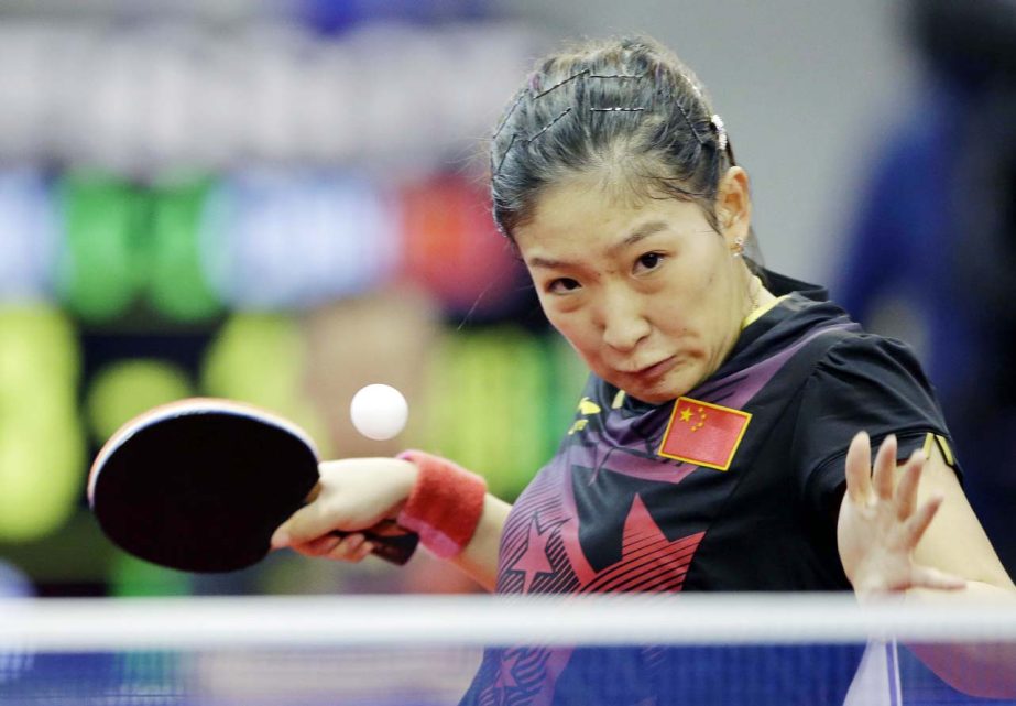 In this Oct. 2, 2014, file photo, China's Liu Shiwen returns a ball against North Korea's Ri Mi Gyong during the women's single table tennis match at the 17th Incheon Asian Games in Suwon, South Korea. China's overwhelming domination of table tennis a