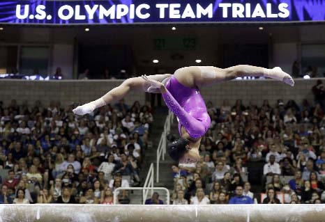 Gabrielle Douglas competes on the balance beam during the women's U.S. Olympic gymnastics trials in San Jose, Calif on Friday.