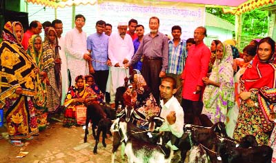 MAGURA: Goats are being distributed in Khamarpara village in Sreepur Upazial organised by Sarothi Kallyan Foundation recently .