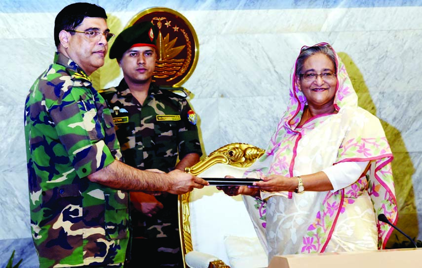 High officials of the Prime Minister's Office submitting reports of different divisions to the Prime Minister Sheikh Hasina after exchanging Eid greetings at her office yesterday.