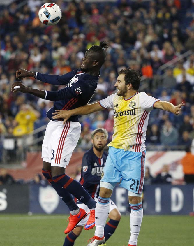 New England Revolution's Kei Kamara (left) and Columbus Crew's Chad Barson (21) compete for the ball during the second half of an MLS soccer match in Foxborough, Mass. The Revolution won 3-1 on Saturday.