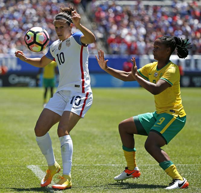 United States midfielder Carli Lloyd (left) controls the ball against South Africa midfielder Amanda Dlamini during the second half of the international friendly women's soccer match in Chicago. United States won 1-0 on Saturday.