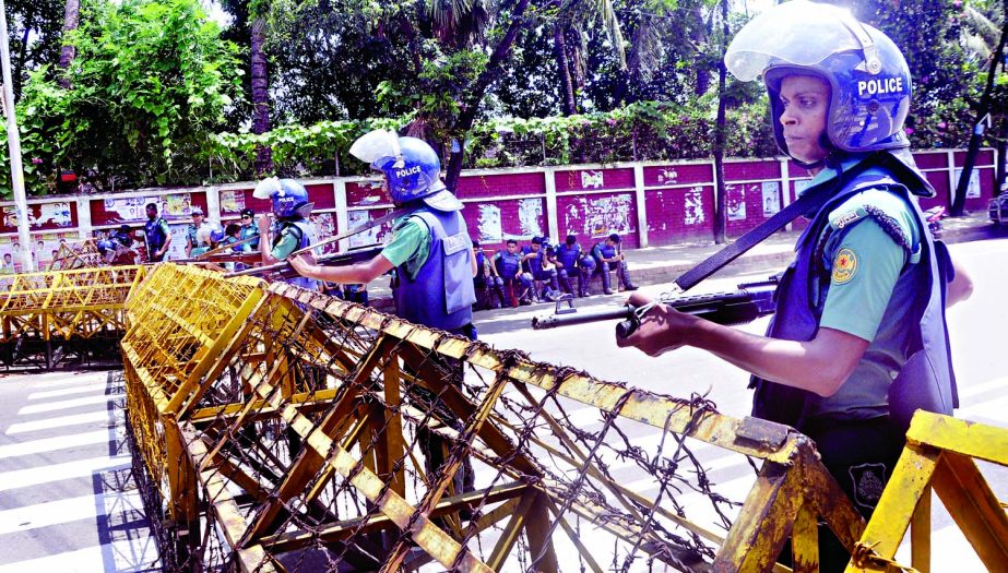 Law enforcers stand guard for security reasons to avoid any untoward incident for 14-party rally. The snap was taken from the city's Doel Chattar area on Monday.