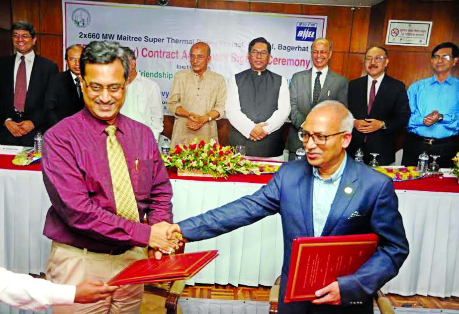 Ujjal Kanti Bhattacharya, Managing Director of Bangladesh-India Friendship Power Company Limited (BIFPCL) and Prem Pal Yadav, representative of Bharat Heavy Electricals Limited (BHEL) handing over document of Engineering Procurement and Construction (EPC)