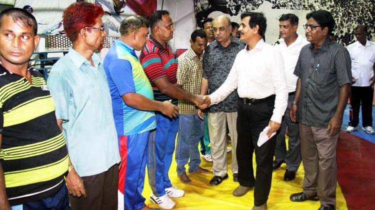 Director (Sports) of National Sports Council Dil Mohammad being introduced with the participants of the wrestling coaches' course at the Gymnasium of National Sports Council on Wednesday.