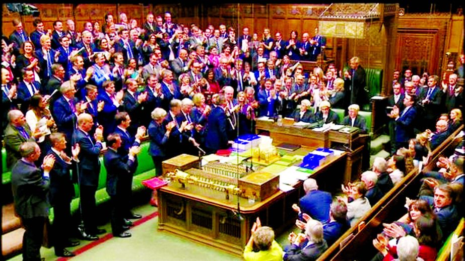 Britain's outgoing Prime Minister, David Cameron, is applauded as he leaves after Prime Minister's Questions in the House of Commons, in central London on Wednesday.