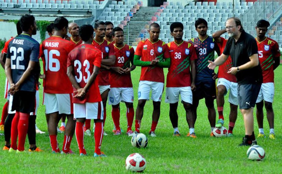 Head Coach of Bangladesh National Football team Tom Saintfiet giving instructions to the players of Bangladesh National Football team during a practice session at the Bangabandhu National Stadium on Thursday.