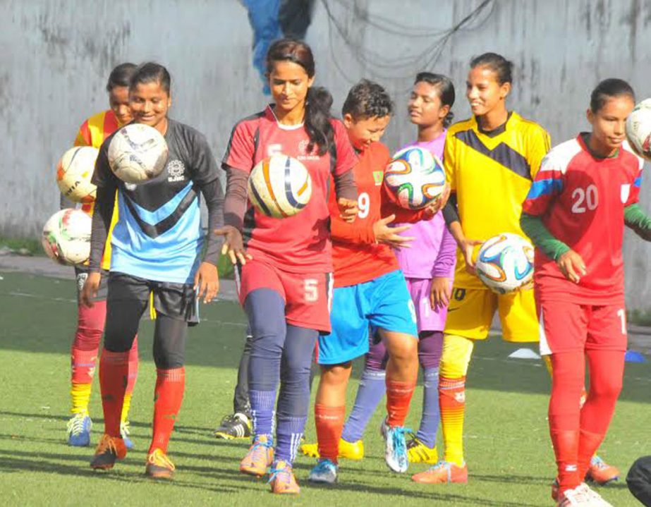 Members of Bangladesh National Women's Under-16 Football team take part at a practice session at the BFF Artificial Turf on Thursday.