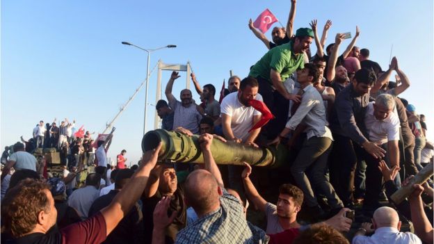 Reuters Image caption Erdogan supporters have been celebrating the surrender of soldiers in Istanbul