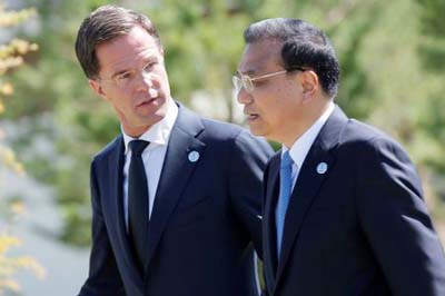 Dutch Prime Minister Mark Rutte chats with Chinese Premier Li Keqiang during the Asia-Europe Meeting (ASEM) summit just outside Ulaanbaatar, Mongolia.