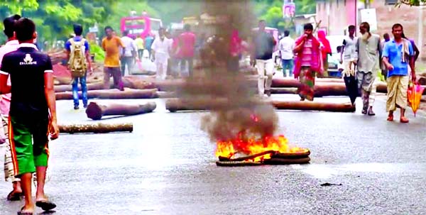 Peopleâ€™s untold sufferings and movement of vehicles disrupted immensely as aggrieved students of Dr. Zahurul Kamal Degree College blocked the Pabna-Dhaka Highway with setting fire on tyres and felling wood-log demanding nationalization of college a
