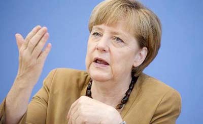 German Chancellor Angela Merkel attends a meeting on EU summit results at the Bundestag in Berlin, Germany.