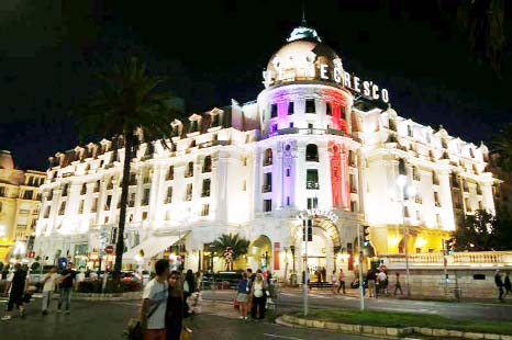 The Hotel Negresco on the Promenade des Anglais in Nice is illuminated in the colours of France's flag, in tribute to the victims of the Bastille Day attack.