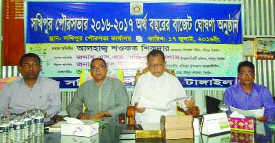 SAKHIPUR (Tangail): Abu Hanif Azad, Mayor, Sakhipur Pourashava announcing budget of 2016-17 fiscal year on Sunday. Among others, Shawkat Sikder, Chairman, Sakhipur Upazila Parishad and S M Rafiqual Islam, UNO were present in the programme.