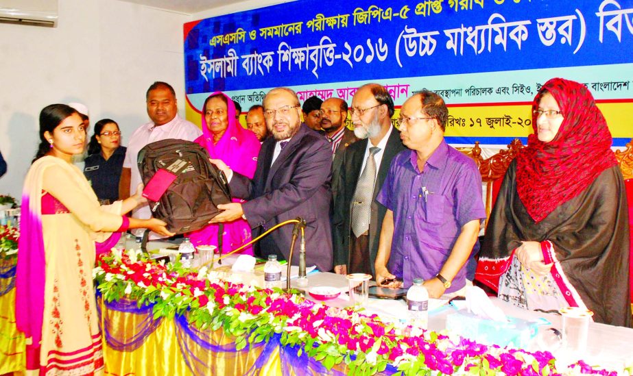 Mohammad Abdul Mannan, Managing Director of Islami Bank Bangladesh Ltd, presenting academic instruments to underprivileged meritorious students at a local Convention Center of Bogra recently.