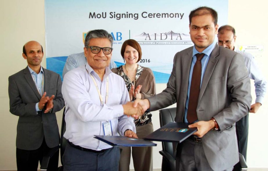 Prof Imran Rahman, Vice Chancellor of University of Liberal Arts Bangladesh and Sunil KC, CEO of Asian Institute of Diplomacy and International Affairs, Katmandu, Nepal are seen exchanging MoU documents after signing a memorandum of understanding between