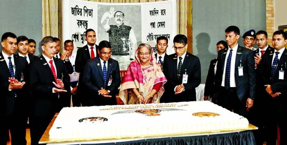 Prime Minister Sheikh Hasina cutting cake marking 30th founding anniversary of Special Security Force (SSF) at its Mess in the city's Tejgaon on Tuesday.