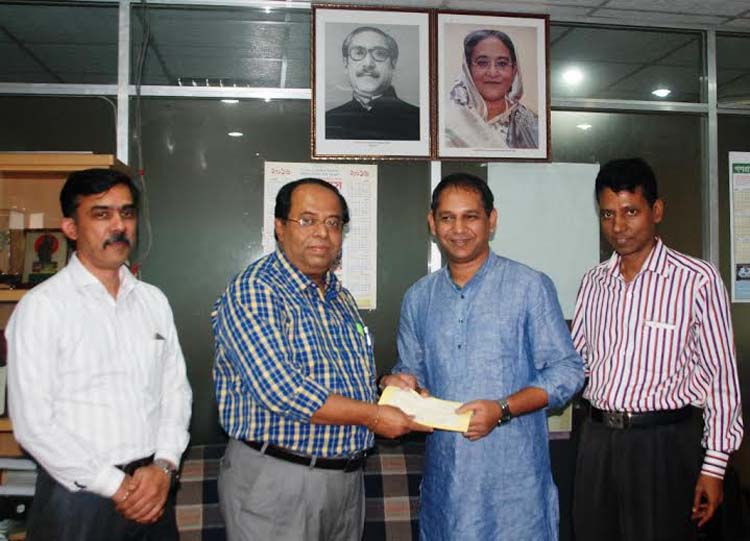 Selector of Bangladesh National Cricket team Habibul Bashar Sumon receiving a cheque of Tk one lakh on behalf of his elder brother Ikram Bashar Tuhin, from Secretary of National Sports Council Ashoke Kumar Biswas (second from left) at the National Sport