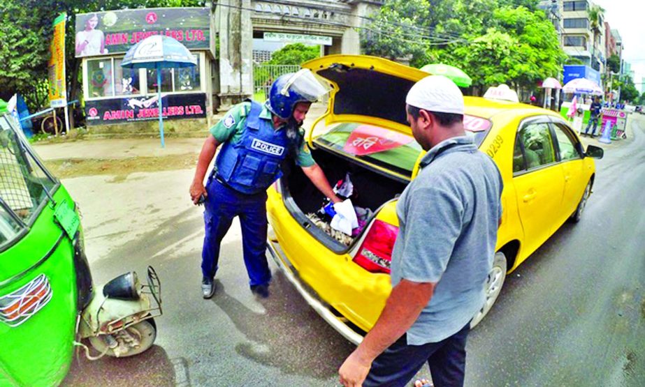 Law enforcers on Tuesday searching vehicles at the entrance point of Gulshan-1 check point in an effort to security measures following the recent militants attack at Gulshan Cafe and Sholakia.