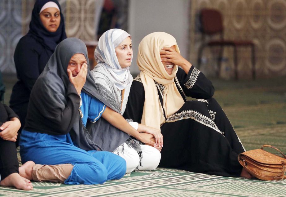 Relatives of 4 year old Kylan Mejri who was killed in Thursday's truck attack, cry at the ar-Rahma mosque in the eastern Nice suburb of Ariane on Tuesday.