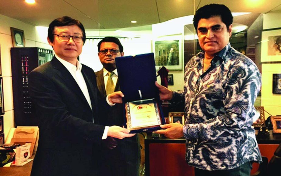 Dr. H B M Iqbal, Chairman of the Board of Directors of Premier Bank Ltd received a Crest of honor recently from the Chief of Korean Community in Bangladesh, Kim Hang Jin (LEO) at Iqbal Center in the city. M. Reazul Karim, Additional Managing Director of t