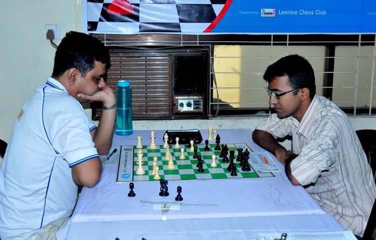 GM Ziaur Rahman (L) of Bangladesh Navy in action during the Prime Bank 19th International Rating Chess Tournament at the Bangladesh Chess Federation hall-room on Wednesday.