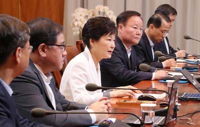 South Korean President Park Geun-hye (3-L) presides over a meeting of her senior secretaries at the presidential office Cheong Wa Dae, South Korea.