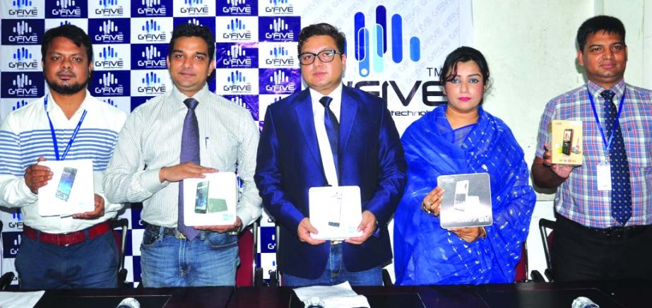 Maxcell Communication Ltd introduces G-Five branded mobile handset in the local market on Thursday. Chairman of the company Maulana Masud (Max) poses in the inaugural programme among others.