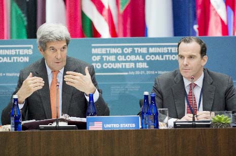 US Secretary of State John Kerry speaks alongside Brett McGurk (R), Special Presidential Envoy for the Global Coalition to Counter ISIL, during a meeting of the Ministers of the Global Coalition to Counter ISIL in Washington.