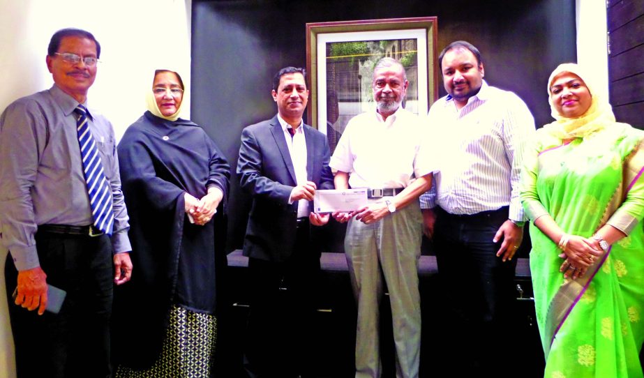 Md. Zakiullah Shahid, Chairman of Prime Insurance Company Ltd. hands over a cheque of Tk. 20 million as settlement of a claim under Industrial All Risk Insurance Policy to M Aminul Haque, Group Chairman of Bangla Trac on Thursday in the city.